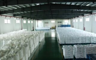 Large warehouse storing bulk bags of phosphate products on pallets